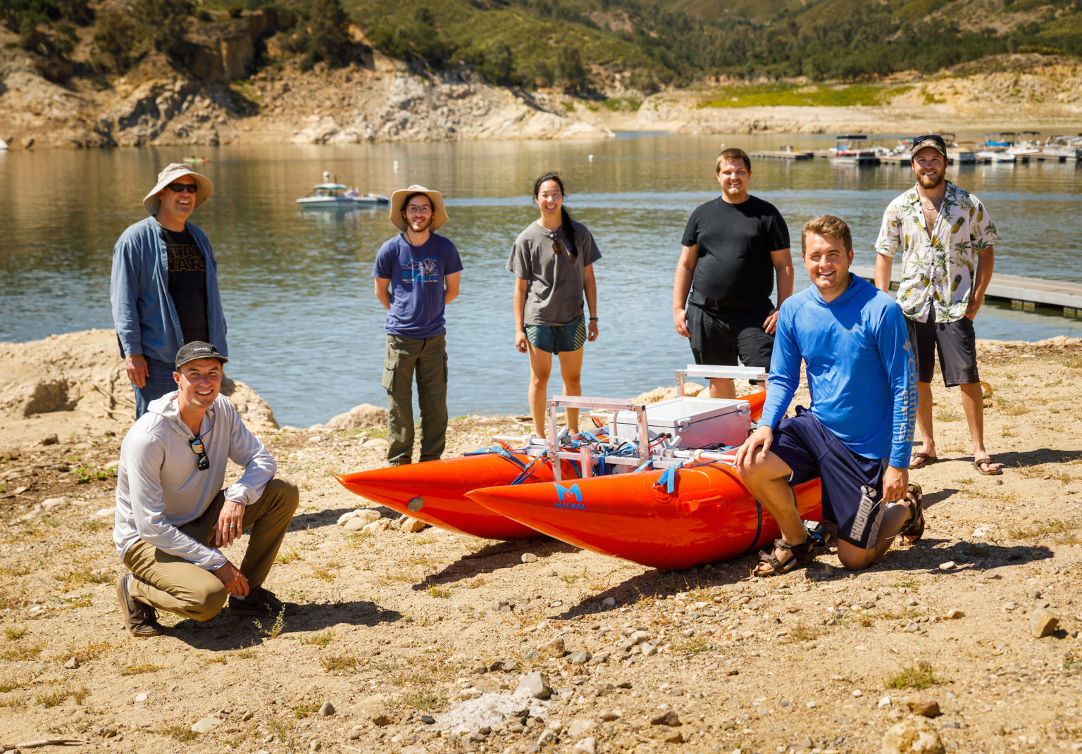 Mechanical engineering students test the research raft they built for their senior project at Lake Nacimiento.