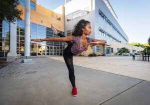 Tori Barrington dancing outside of engineering building at Cal Poly