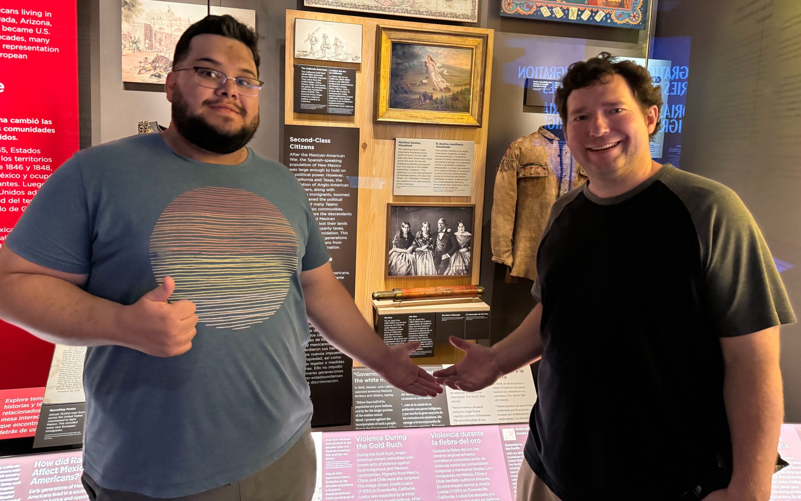 Computer science master’s student Anthony Colin Herrera, left, and history lecturer Cameron Jones standing in front of an exhibit in the Smithsonian National Museum of American History.