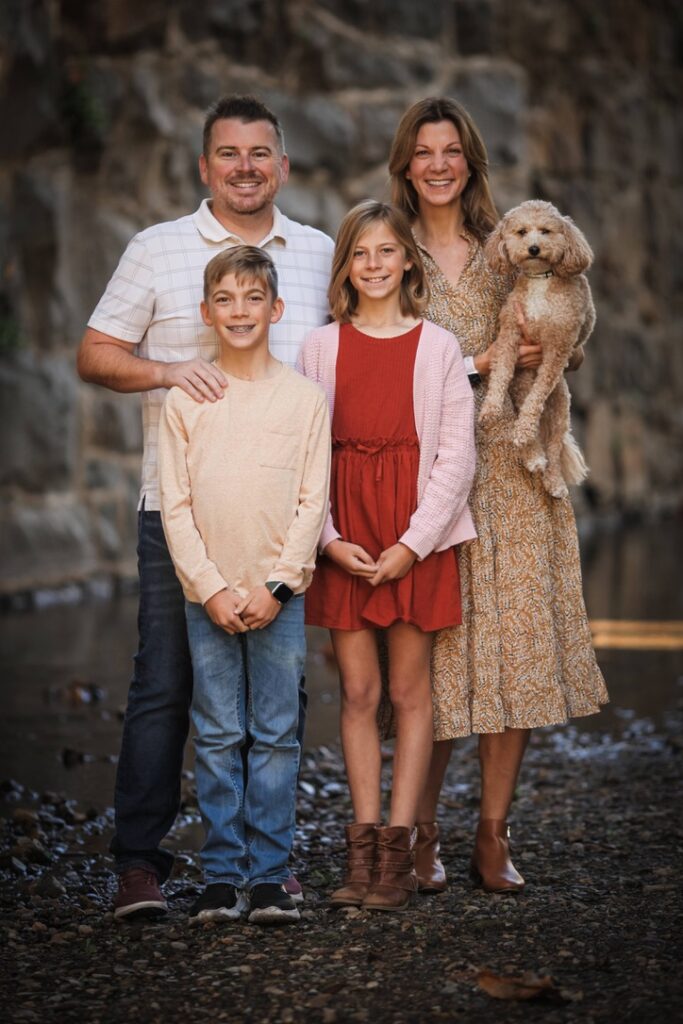 Headshot of Daniel and Carlene Iverson with their daughter Ainsley, son Austin and goldendoodle Sunny. 